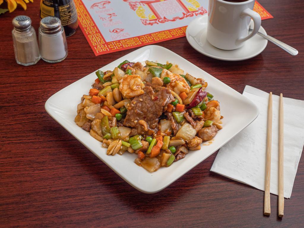Kung Pao Combination · Chicken, beef and shrimp stir-fried with fresh onions, celery, green peppers, peas, carrots, water chestnut and peanuts in spicy sauce. Hot & spicy.
