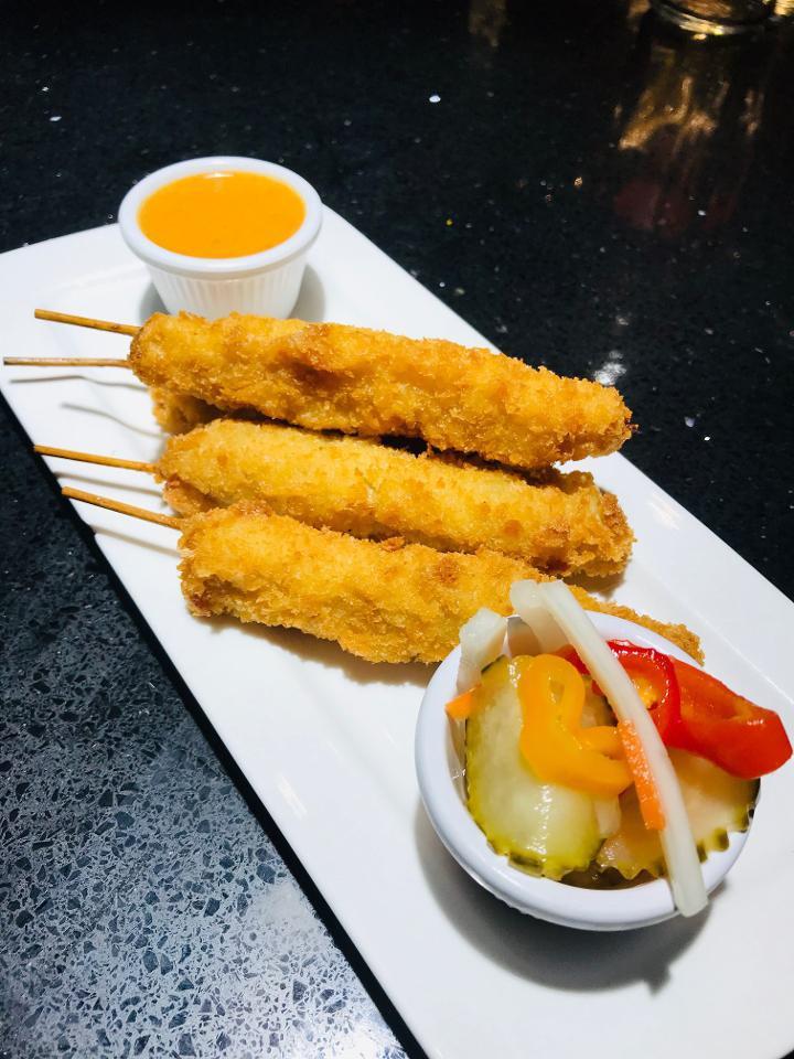 Fried Chicken Satay on Skewers · Batter Fried Traditional curry-coconut chicken skewers with peanut sauce and Asian pickle.
