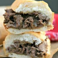 Philly Cheese Steak Sub · Well cooked Steak, sauteed onions and melted Cheese