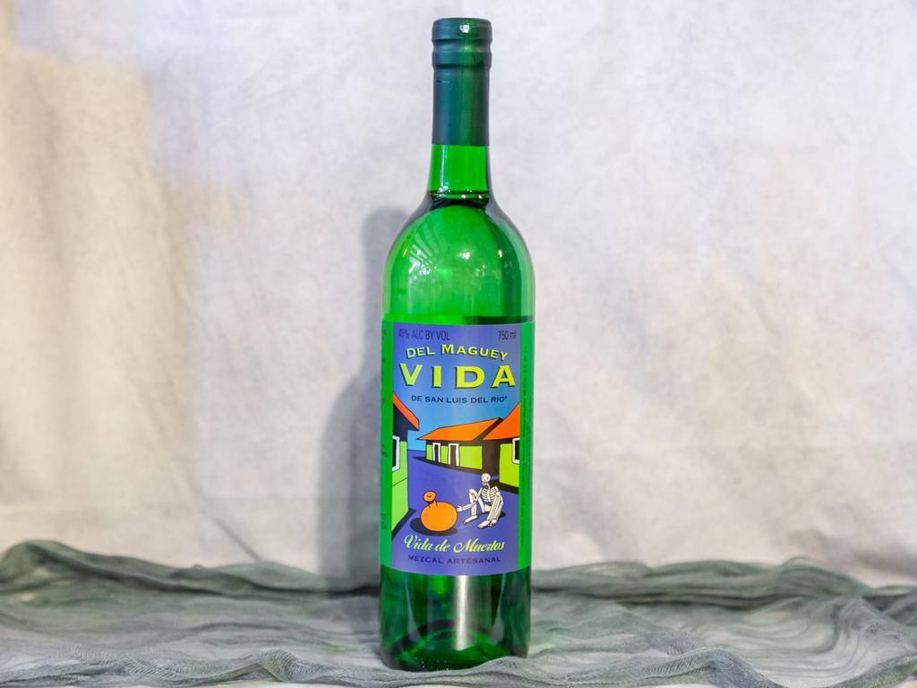 Del Maguey Vida Mezcal · Must be 21 to purchase. 750 ml. bottle. Del Maguey Vida San Luis Del Rio Mezcal is the perfect place to start when you want to try mezcal. This Mexican liquor is a little harder to find than tequila and other options, but Del Maguey has made its Vida Mezcal easy to get and at an entry-level price. It tastes delicious in mixed drinks and will introduce you to the world of mezcal.  This mezcal is distilled twice and hand-crafted. Del Maguey uses wood-fired copper stills, which bring out fruity aromas and other sweet notes such as honey and vanilla. On your palate, experience cinnamon, banana, tangerine and even sandalwood.  Wondering why you should opt for mezcal over tequila? Both mezcal and tequila are Mexican liquors distilled from the agave plant. Mezcal and tequila come from different regions in Mexico and often from different varieties of agave plant. Tequila must come from the Blue Agave plant, while mezcal can come from any agave plant. Most mezcal comes from Agave Espadin, including the Del Maguey Vida variety.  Though you can try sipping Del Maguey Vida Mezcal to understand what mezcal is and how it should taste, this mezcal is designed to taste delicious in cocktails. The fruit notes and long finish make it perfect for fruitier mixes, such as a Sierra Madre Sunrise, which is made of mezcal plus Aperol, chocolate bitters and lemon juice. Try making a Mezcal Julep with basil and cranberry for a fruity twist on the classic. Remember to use quality juices and ripe fruits for best results.   