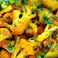 Aloo Gobi · Vegan. Gluten Free. Locally grown cauliflower and potatoes cooked in ginger, turmeric and to...