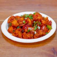 Spicy Gobi Chilli · Vegan. Gluten Free. Spicy stir fry of cauliflower with onions green peppers and tomatoes in ...