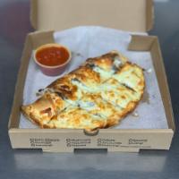 Philly Steak Combo Gourmet Calzone · Steak, onion, green peppers, and mushrooms.
