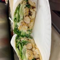 Chicken Caesar Hot Wrap · Romaine lettuce, croutons, Caesar dressing and Parmesan cheese.