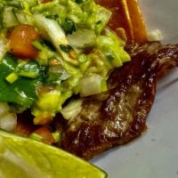 rancho taco dinner (skirt steak) · 3 big skirt steak tacos on corn tortilla (karla style) with guacamole and pico de gallo on t...