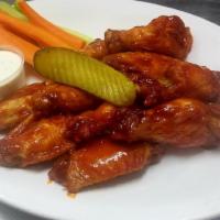 Jumbo Chicken Wings · 10 breaded and fried Buffalo, Sweet Chili, Nashville Hot, or Whiskey BBQ wings served with h...