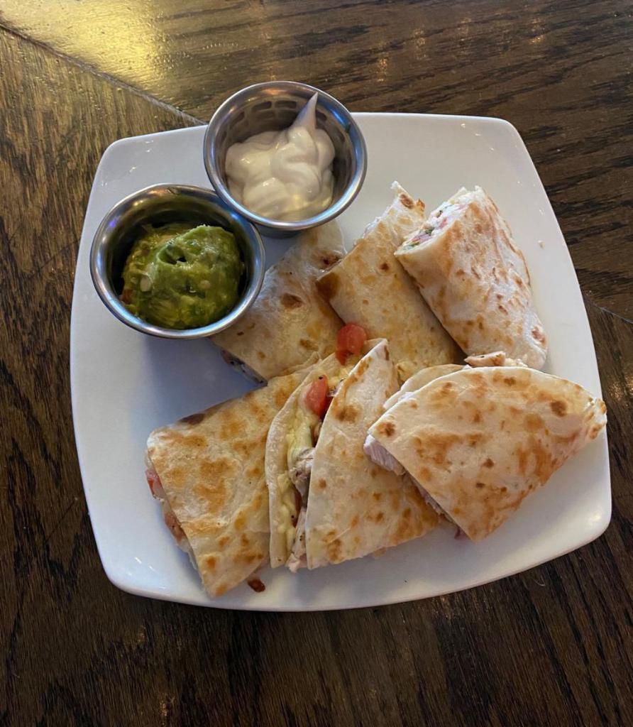 Coach's Quesadilla · Flour tortilla filled with chihuahua cheese and pico de gallo.  Served with salsa and guacamole