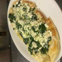 Spinach and Goat Cheese Flatbread · Flatbread topped with mozzarella, garlic, spinach, and goat cheese