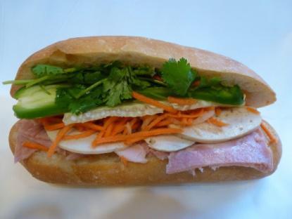 1. Combination Sandwich · Ham, fancy pork, marinated carrots and daikons, cilantro, cucumber, jalapenos in hot french baguette.