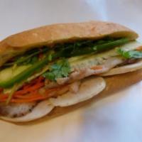 2. Classic Combo Sandwich · Roast pork, fancy pork, marinated carrots and daikons, cilantro, cucumber, jalapenos in hot ...