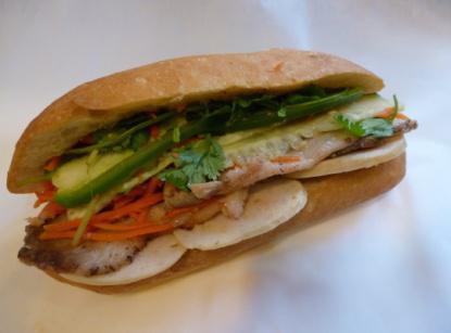 2. Classic Combo Sandwich · Roast pork, fancy pork, marinated carrots and daikons, cilantro, cucumber, jalapenos in hot french baguette.