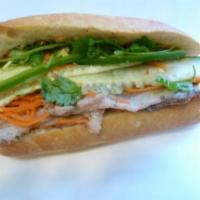 5. Roast Pork Sandwich · Roast pork, marinated carrots and daikons, cilantro, cucumber, jalapenos in hot french bague...