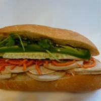 7. Fancy Pork Sandwich · Steamed pork, marinated carrots and daikons, cilantro, cucumber, jalapenos in hot french bag...