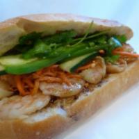 8. Tamarind Shrimp Sandwich · Shrimp with special sauce, marinated carrots and daikons, cilantro, cucumber, jalapenos in h...