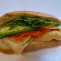 9. Tofu Sandwich · Fried tofu, marinated carrots and daikons, cilantro, cucumber, jalapenos in hot french bague...