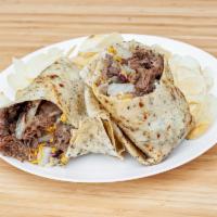The Cave Steak Wrap · Tender steak served with tomato, onion, green pepper, cheddar cheese and your choice of pest...