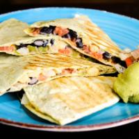 Hummus Quesadilla · Toasty tortilla with a spread of roasted bell pepper hummus, black beans, onion, and bell pe...