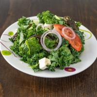 47. Greek Salad · Romaine lettuce, tomato, cucumbers, onions, peppers, feta cheese and grape leaf.