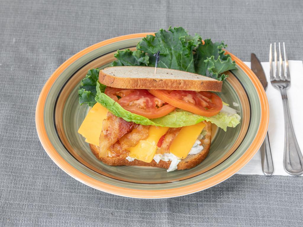 64. The Billy Jean Sandwich · Chicken salad, bacon, cheddar cheese, lettuce and tomato.