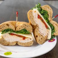 71. Carroll Gardens Sandwich · Smoked Turkey, arugula, mozzarella, sun dried tomatoes, oil and vinegar.