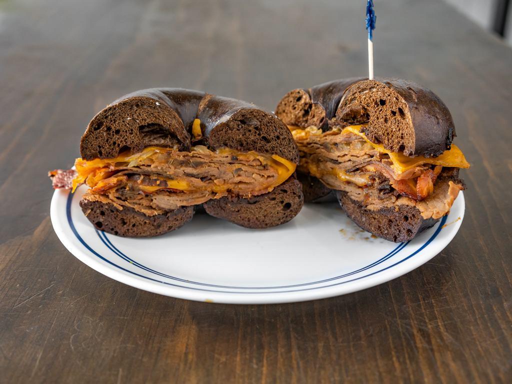 90. The Peter Luger Sandwich · Roast beef, melted cheddar cheese, cooked onions, bacon and Peter Luger sauce.
