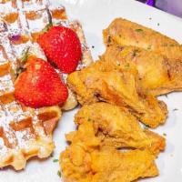 Chicken ＆ Waffles Traditional · Four seasoned deep fried golden battered chicken wings and sweet buttered waffles.