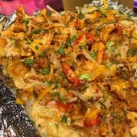 Loaded Seafood Baked Potato · Stuffed baked potato loaded with grilled shrimp, grilled crawfish, butter, shredded cheese, ...
