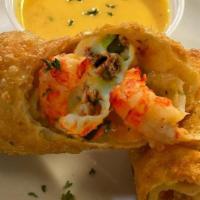 Seafood Eggrolls · Stuffed with grilled shrimp, crawfish tails, cheese and cajun rice. Served with signature di...