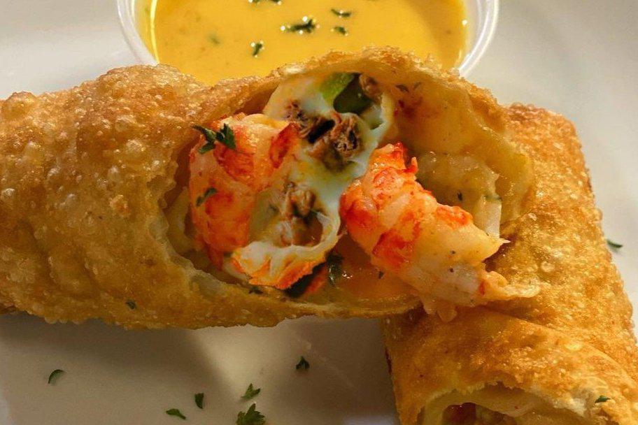Seafood Eggrolls · Stuffed with grilled shrimp, crawfish tails, cheese and cajun rice. Served with signature dipping sauce. 