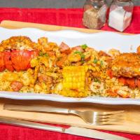 Stuffed Lobster Tails w/Loaded Rice · 2 Seasoned grilled lobster tails stuffed with cajun fried rice and loaded with grilled shrim...