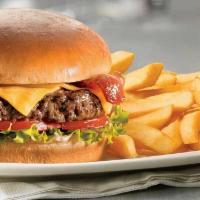 Classic Beef Burger · 8 oz seasoned beef with cheese, lettuce, tomatoes, pickles, and onions on a soft buttered bun.