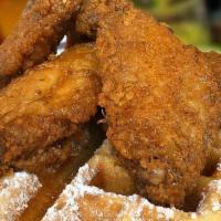 Chicken ＆ Waffles · Four seasoned deep fried golden battered chicken wings and sweet buttered waffles.