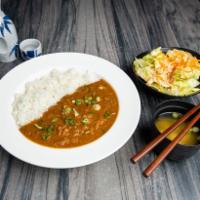 D4. Spicy Tender Beef Curry Rice · Spicy tender beef stew curry with rice. Meal in a bowl served over hot rice. Includes miso s...