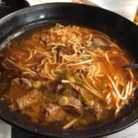 R8. Hot and Spicy Beef Ramen · Ramen noodle soup with spicy beef stew, fried scallions, bean sprouts, wood ears, green onio...