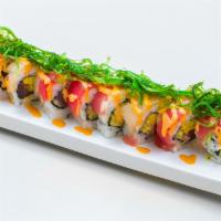 H11. Rock and Roll · Tuna, avocado and cucumber, wrapped in tuna, yellowtail and seaweed salad, with spicy sauce.