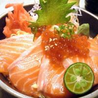 S8. Sake Ikura Donburi · Sliced salmon sashimi and salmon roe over sushi rice in a bowl.