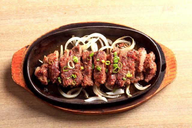 E15. Wafu Steak · New York steak with onion and soy sauce.