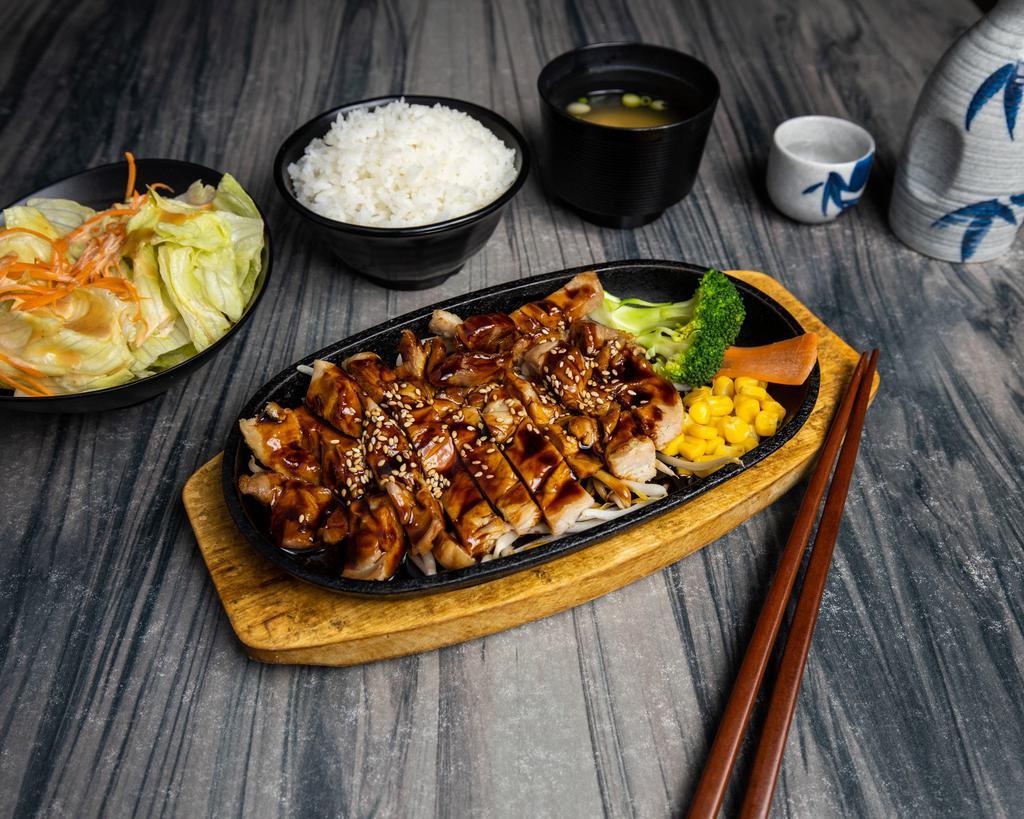 E1. Chicken Teriyaki · Broiled chicken with teriyaki sauce. Served with miso soup, salad and rice.