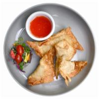 Stuffed Wontons · Fried wontons stuffed with ground chicken. Served with sweet n’ chili sauce.