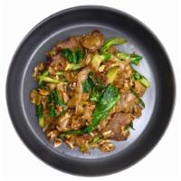 Pad See Ew · Flat rice noodle stir-fried with egg in sweet black soy sauce, and Chinese broccoli.