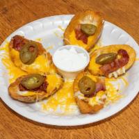 Potato Skins  · Served with cheese and sour cream. 