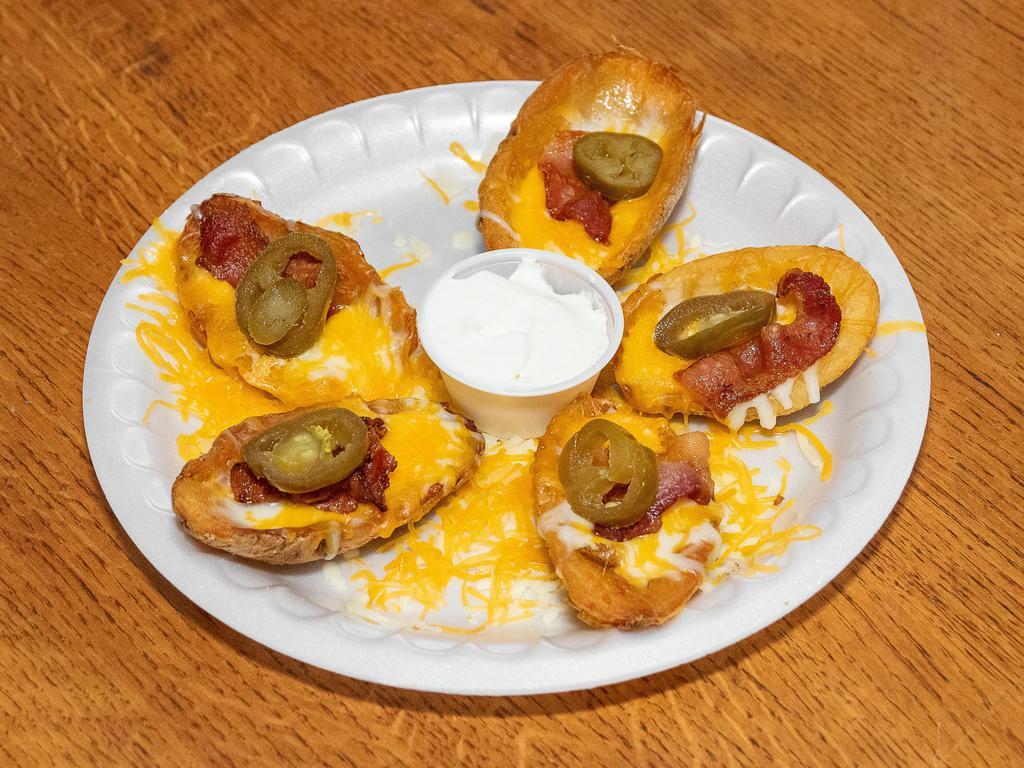 Potato Skins  · Served with cheese and sour cream. 