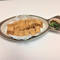 Fried Tofu · Deep fried tofu served with sweet and sour sauce, ground peanut, and cilantro.