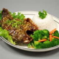 Fried Tilapia  · Deep-fried the whole fish with garlic sauce or spicy sauce and steamed vegetable.