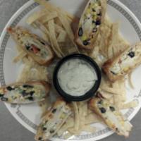 Southwest Egg Rolls · Fajita chicken mixed with cheddar jack cheese, corn, black beans, and pico de gallo and wrap...