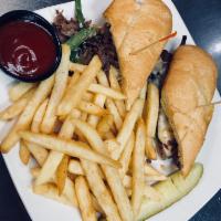 Philly Cheese Steak Sandwich · Shaved ribeye steak, bell peppers, onions and mozzarella cheese on a hoagie roll.