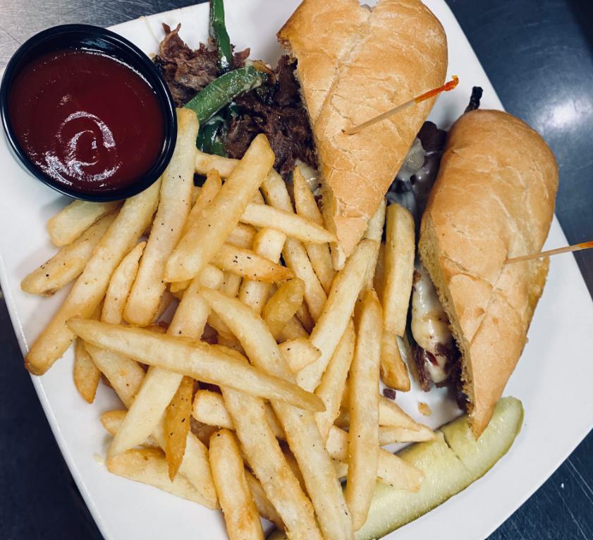 Philly Cheese Steak Sandwich · Shaved ribeye steak, bell peppers, onions and mozzarella cheese on a hoagie roll.