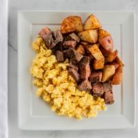 Steak and Eggs Breakfast · Ribeye steak and scrambled eggs with a side of roasted garlic red potatoes.