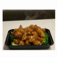 Orange Chicken · Chicken tossed in a sweet and spicy orange sauce. With white rice, fried rice or lo mein. Sp...