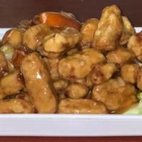 Vegetarian Orange Chicken · Vegetarian chicken tossed in a sweet and spicy orange sauce. Served with choice of white ric...